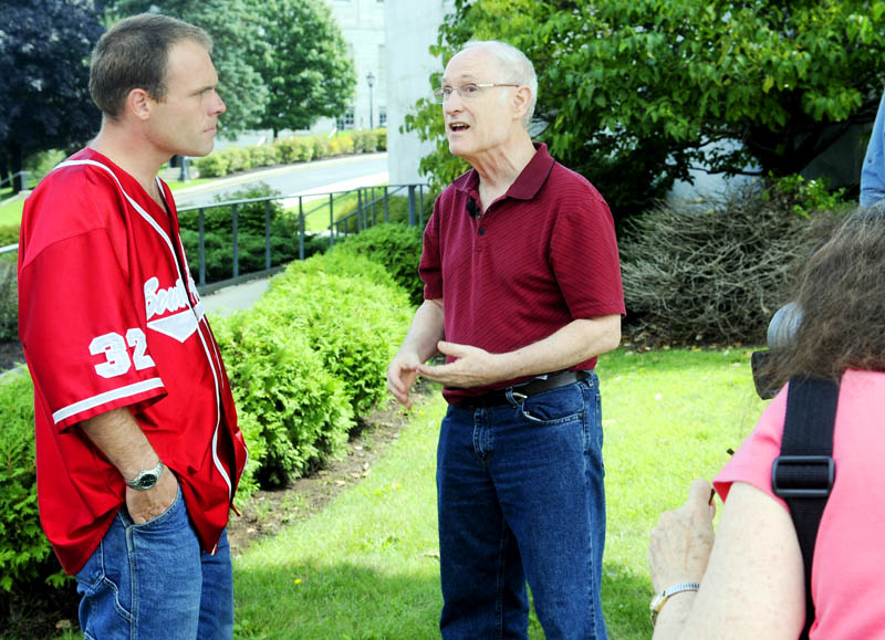 Terry Sterrenberg, center, interviews Rusty Vonaa, left, as Laurie Simons tapes on Tuesday in Augusta about health care. A husband and wife team, Sterrenberg and Simons are touring the country with the Drive for Universal Healthcare group to make a video about single payer health care.