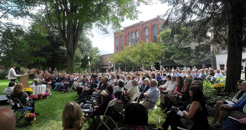 Karen Heck, mayor of Waterville, speaks about the life of Bill Taylor during a celebration of his life, with over 450 of his friends and family at Castonguay Square in downtown Waterville today.