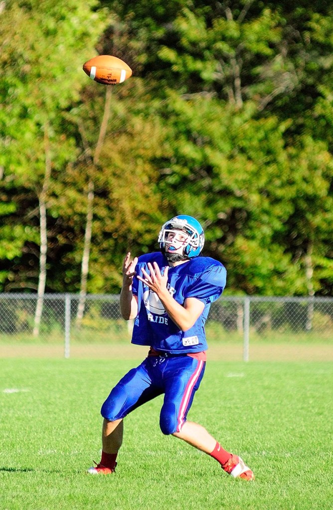 LOOK IT IN: Oak Hill’s Alex Mace has a difficult job — to catch a kicked football and make a play. Mace is just one of several area players dealing with the same task every Friday night or Saturday afternoon.