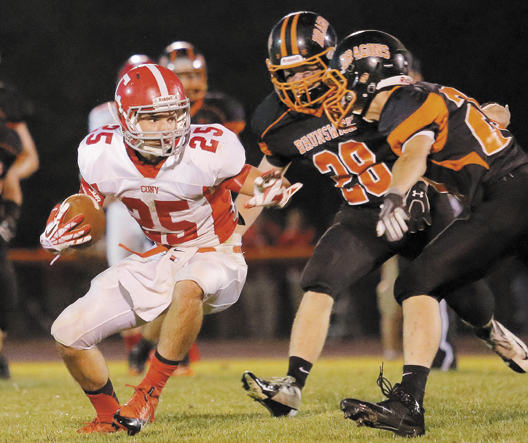 Cony's Tayler Carrier tries to make a move around Brunswick defenders Will Bessey, center, and Bailey Caparratto on Friday in Brunswick.