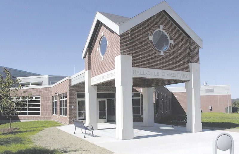 Hall-Dale Elementary School's entrance. Team Hall-Dale, a group organized by Hallowell City Council candidate Andrew McPherson, hoped to raise $558,000 by June 2004 to fund upgrades to the school that the state wouldn't pay for, but raised only $241,000, about 41 percent of the goal, before fundraising ended. While plans are afoot to revive the group and the fundraising effort, Regional School Unit 2 chairwoman Dawn Gallagher says McPherson's campaigning on opposition to higher taxes is dismaying, as the school department has had to make up the funding gap left by Team Hall-Dale's efforts falling short.