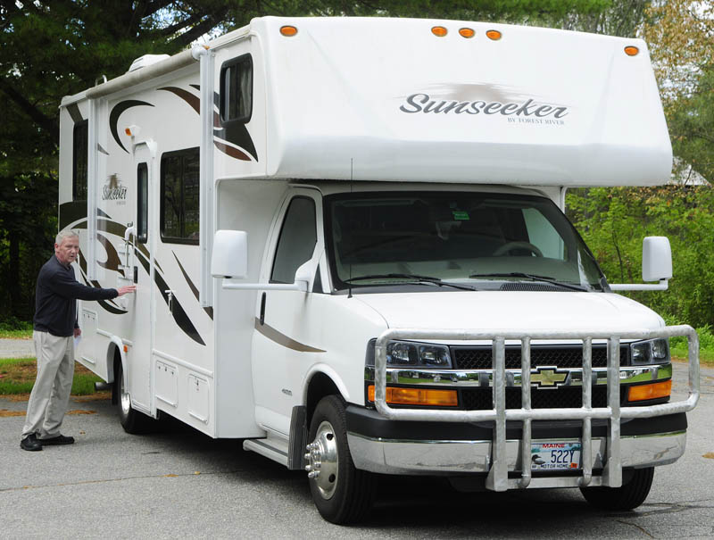 Chris Harnish enters his 30-foot motor home during on Thursday in Augusta.