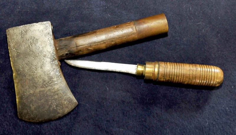Among items in Howard Hardy's collection of axes manufactured in Oakland is an ax with a handle that unscrews to yield a knife.
