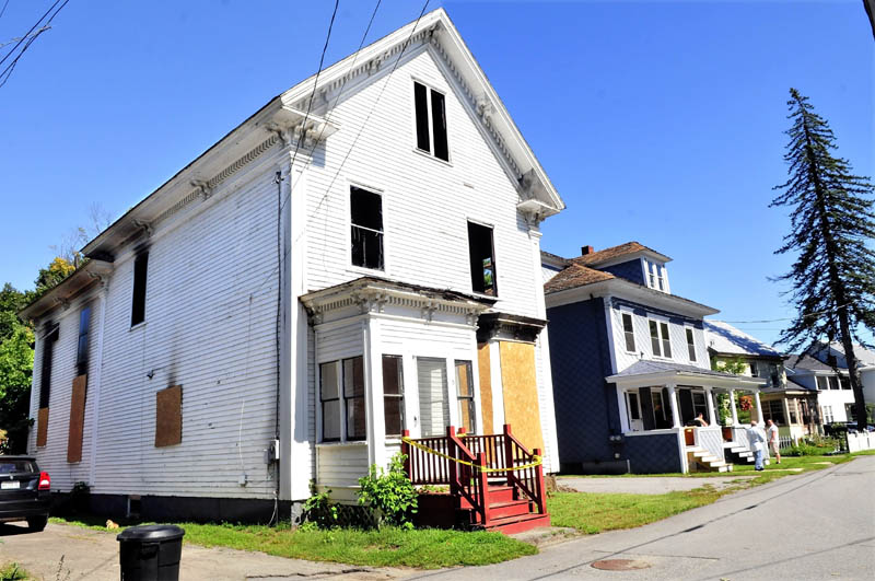 This home on Elm Court in Waterville was destroyed by fire on August 25. Neighbors are hoping the Texas bank that owns the building will tear it down soon.