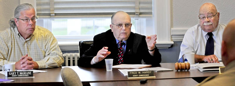 Franklin County Commissioners, from left, Gary McGrane, Fred Hardy and Clyde Barker voted today to withhold the county's November jail payment to the Board of Corrections.