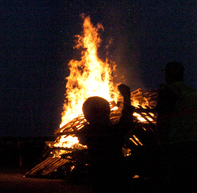 Waterville students celebrate tonight night with a bonfire and pep rally at Head of Falls before homecomng events Saturday. Isiah Vear, 7, was there with his family.