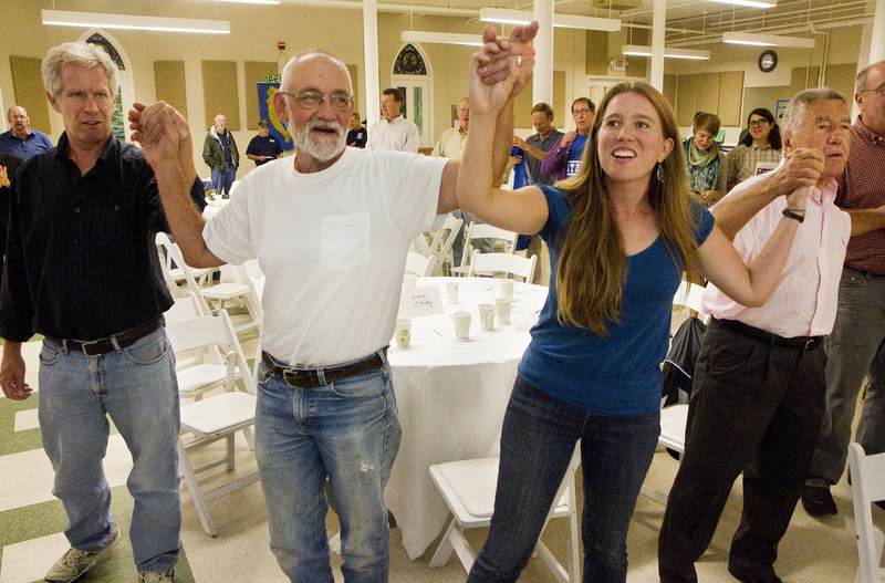 People at the Southern Maine Labor Council’s Labor Day breakfast sing “Solidarity Forever.” From left are Ned McCann of Portland, Peter Kellman of North Berwick, Sarah Bigney, AFL-CIO staff from Hallowell, and Charles Scontras of Cape Elizabeth.