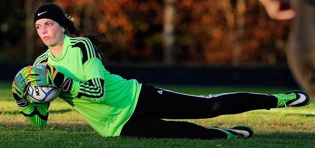 Staff photo by Joe Phelan Maranacook keeper Elizabeth D'Angelo makes a save during a playoff soccer game on Tuesday October 29, 2013 at Hall-Dale High School in Farmingdale.