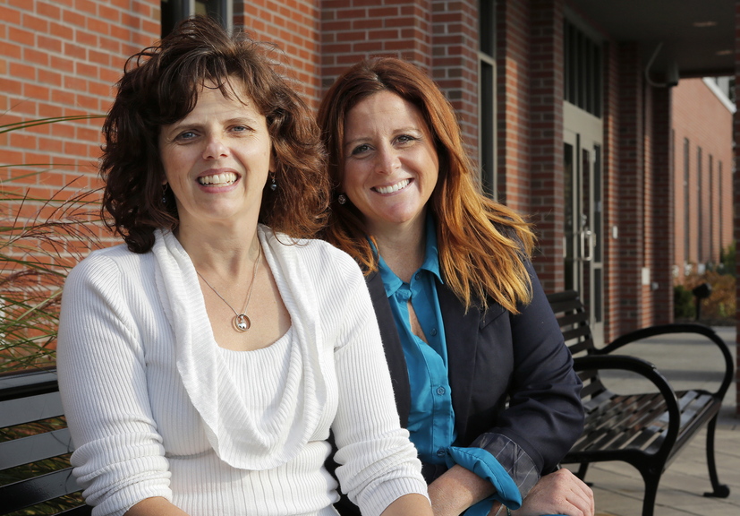 Sara Devlin of South Portland, right, created a Gofundme for Rebecca Grover, left, her co-worker at the Maine Turnpike Authority, after Grover’s husband passed away in 2012. In the 11 months since the account was created, 172 people have donated $23,000 to help Grover and her two children.