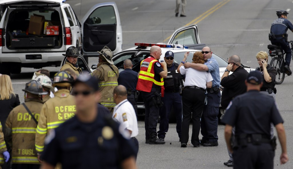 Police gather near where shots were fired on Capitol Hill in Washington on Thursday.