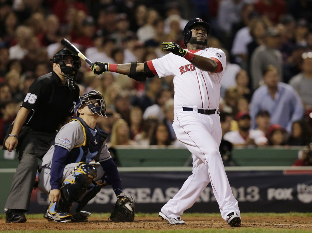 Boston Red Sox designated hitter David Ortiz watches his second home run of the game off Tampa Bay Rays starting pitcher David Price, in front of Rays catcher Jose Molina in the eighth inning in Game 2 of baseball’s American League division series Saturday, Oct. 5, 2013, in Boston.
