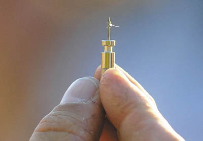 Lt. David Rackliffe holds one of the barbs from the stun gun that shocked Franklin County Sheriff Scott Nichols during a demonstration at the Franklin County Sheriff's open house in Farmington on Wednesday.