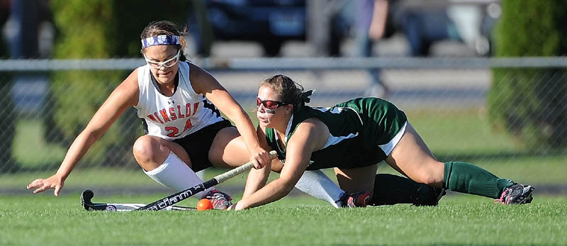 MAD SCRAMBLE: Winslow’s Brooke Haskell, left, collides with Mt. View’s Lindsey Moody in the first half Thursday in Winslow. Winslow defeated Mt. View 3-0.