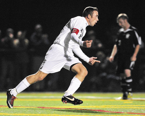 GOOD START: Hall-Dale’s Konnor Longfellow celebrates after scoring a first-half goal that put the Bulldogs up 1-0 against St. Dominic on Friday at Thomas College in Waterville.
