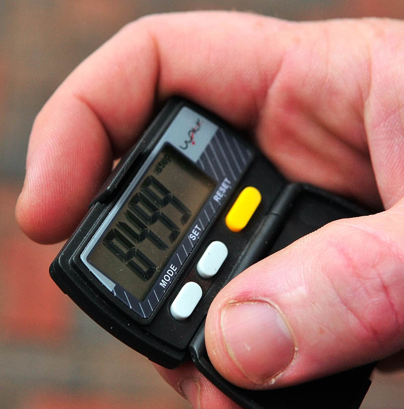 Gardiner Main Street executive director Patrick Wright looks at pedometer display on Friday, Oct. 11 in Gardiner.