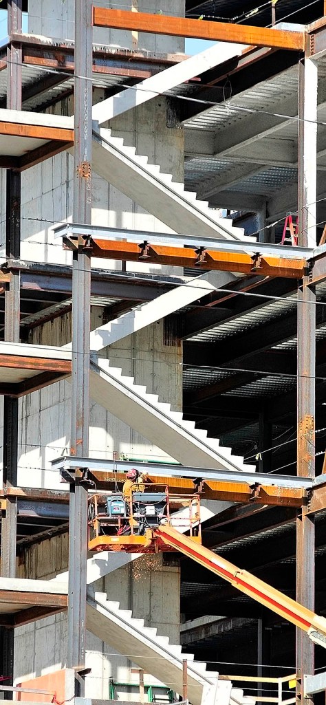 A welder works up on a lift on Tuesday as construction continues on the new Kennebec County Superior Court House being built in Augusta.