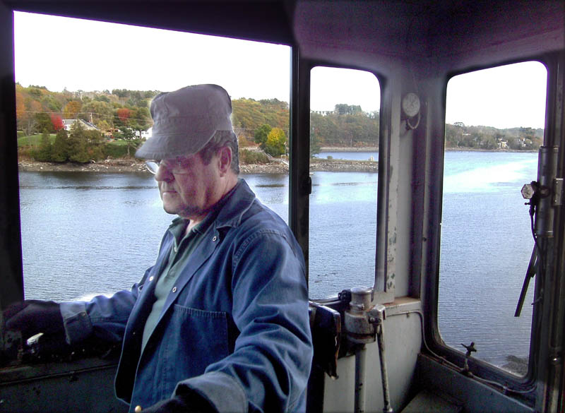 Belfast & Moosehead Lake Railroad train engineer Peter Reny throttles an engine along the Passagassawakeag River in Belfast during a recent scenic ride.