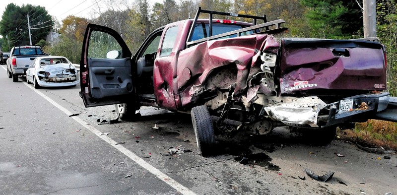 CHAIN REACTION: This Warden Service truck was rear-ended by a vehicle traveling south on Route 150 in Skowhegan causing the vehicle to overturn and the truck to smash into the vehicle ahead of it on Thursday, Oct. 10, 2013.