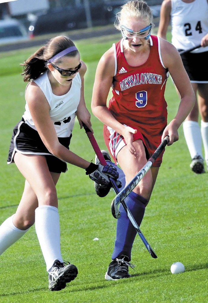 Staff photo by David Leaming CROSSED: Skowhegan’s Tori Mullin, left, and Messalonskee’s Mikayla Turner battle for the ball Monday in Skowhegan.