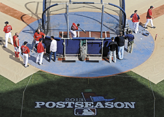 GETTING READY: Dustin Pedroia takes batting practice Thursday at Fenway Park in Boston as the Red Sox prepare to face the Tampa Bay Rays in the ALDS. Game 1 is today at 3:07 p.m.