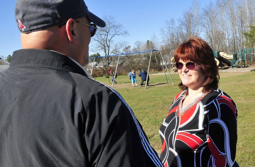 The new Athens Community School Principal Cynthia Streznewski speaks with head teacher Edward Ellis as children play during recess recently.