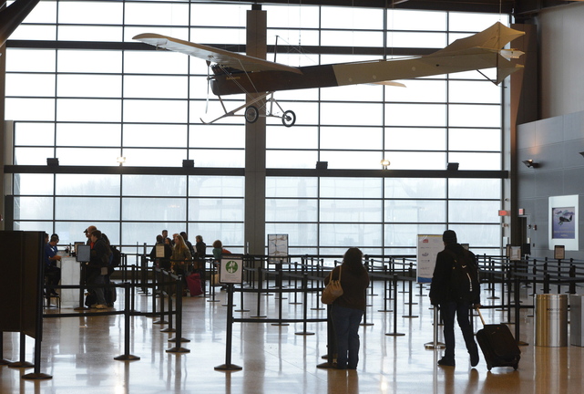 John Patriquin/Staff Photographer Travelers at the Portland Jetport wait in a screening line, Wednesday, Nov.27, 2013.