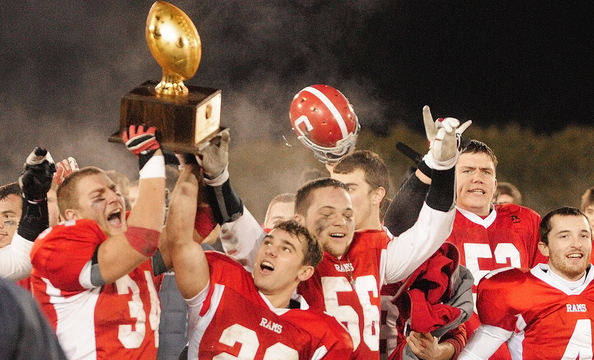 CHAMPS: Cony Rams celebrate with gold ball trophy after beating Kennebunk to win the Class B state championship Friday in Orono.