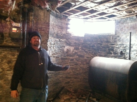 Patrick Mulkern was showered with dust and debris when a car hit the foundation of a house at the corner of Mellen Street and Cumberland Avenue on Tuesday.