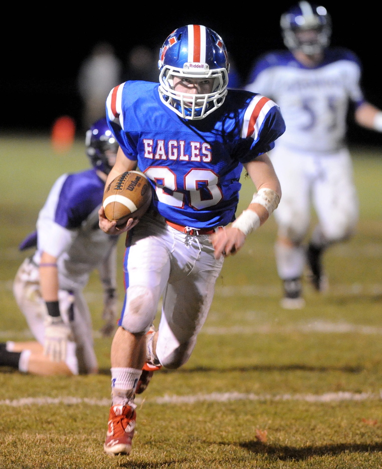ON THE RUN: Messalonskee High School’s Corey McKenzie, 20, runs for a touchdown against Hamden Academy in the second quarter inOakland on Friday night.