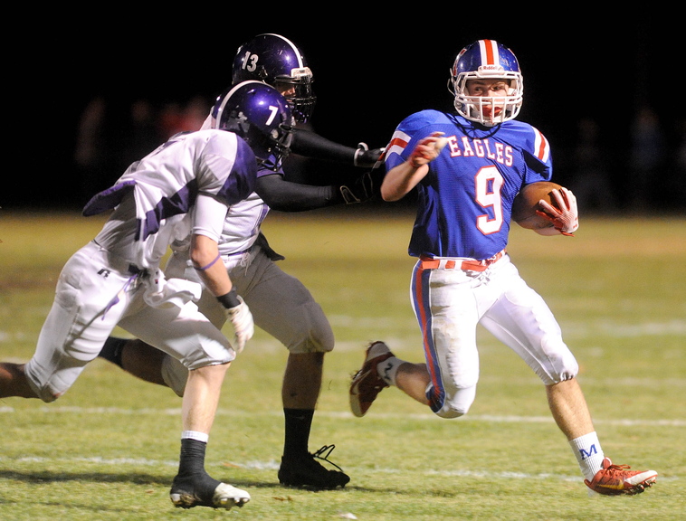 GO: Messalonskee High School’s Zach Mathieu, 9, is pursued by Hamden Academy defenders Josh Hoch, 13, and Austin Spencer, 7, in the first quarter in Oakland on Friday night.