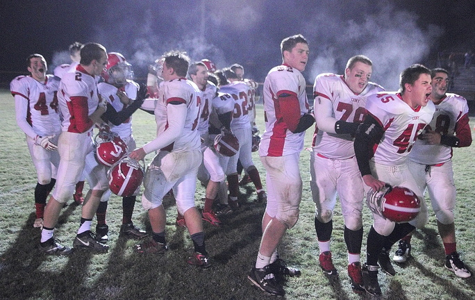 Staff photo by Joe Phelan Cony Rams celebrate after winning Pine Tree Conference class B championship on Friday November 15, 2013 in Brunswick.