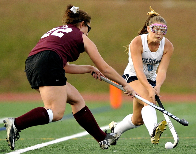 TAKE IT AWAY: Mikayla Charters of Nokomis uses her stick to try to steal the ball away from Alexandra Jones of York during the Class B field hockey state championship at Yarmouth High School.