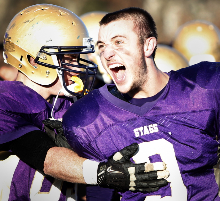 Tim Greenway/Staff Photographer Cheverus High School quarterback Will Hilton screams after Cheverus High School defeated Portland High School at Cheverus High School during the Eastern Class A football championship game in Portland on November 16, 2013.