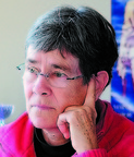 MaineHousing executive director Dale McCormick listens to a conference call on Friday morning in her Augusta office.