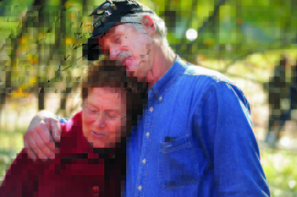 FINALLY, A THANK YOU: Anne Koch Voigt, left, of Gilbertsville, Pa., is embraced by Larry Sudweeks, of Brentwood, Calif., during an event on Veterans Day to honor the 20th anniversary of the Vietnam Women’s Memorial in Washington, D.C. Voigt was a nurse in Vietnam who cared for Sudweeks after he was wounded in combat.