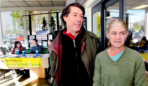 INTERESTED: Peter Richmond and Phyllis Leonard speak about their interest in Affordable Health Care after getting information from HealthReach workers, in background, who had a table set up at Jimmy’s Market in Bingham on Thursday.