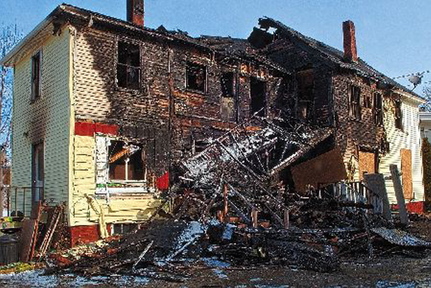 Unsafe: This March 22, 2013 file photo shows 146 Northern Avenue in Augusta the morning after it was heavily damaged by a fire. City officials say firefighters were briefly trapped inside the building while fighting the fire, which is one reason why they want permission to inspect Pepin’s properties. The building has since been demolished.