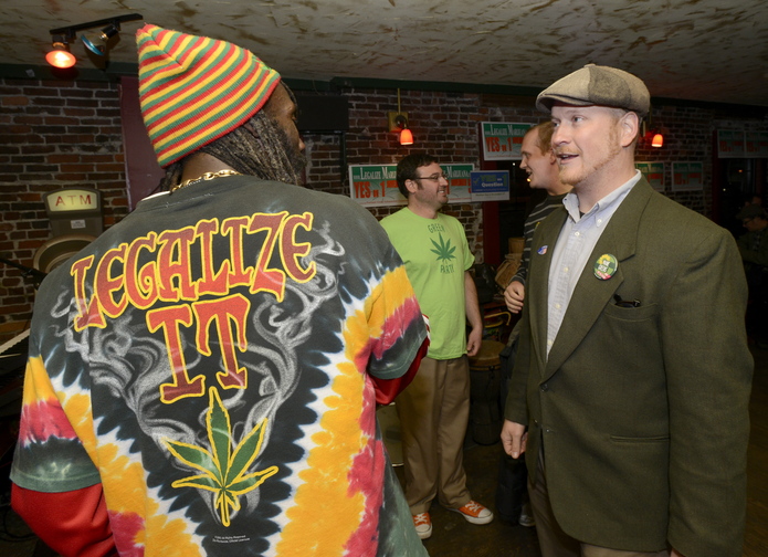 Stream Reggae band member Nyah Henderson talks with Portland city councilor David Marshall before the band played at the Yes on 1 campaign celebration at Brian Boru in Portland.