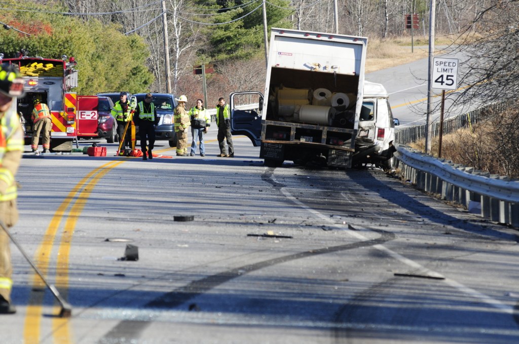 Emergency crews work at the scene of a collision between a conversion van and a panel truck near intersection of U.S. Route 202 and Royal Street on Thursday November 21, 2013 in Winthrop. State Police troopers were using surveying equipment as part of their reconstructing the accident scene.