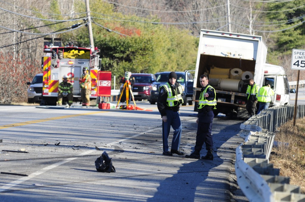 Emergency crews work at the scene of a collision between a conversion van and a panel truck near intersection of U.S. Route 202 and Royal Street on Thursday November 21, 2013 in Winthrop. State Police troopers were using surveying equipment as part of their reconstructing the accident scene.