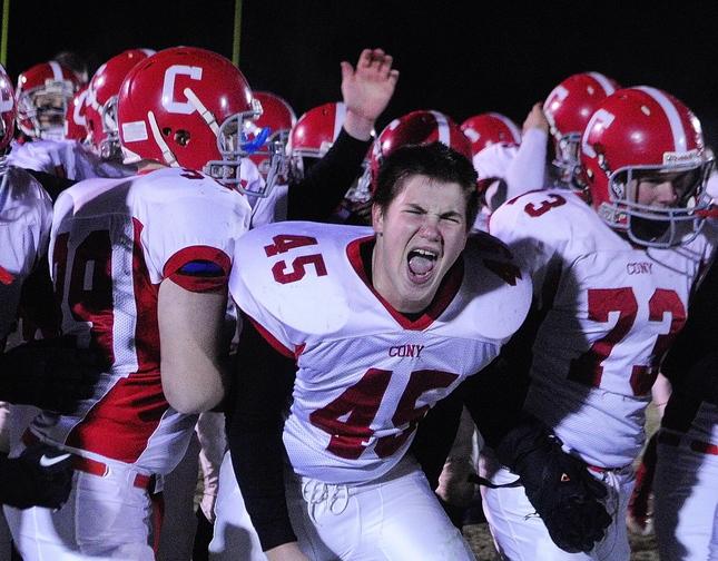 Staff photo by Joe Phelan Anthony Moore, 45, and rest of Cony Rams celebrate after winning Pine Tree Conference class B championship on Friday November 15, 2013 in Brunswick.