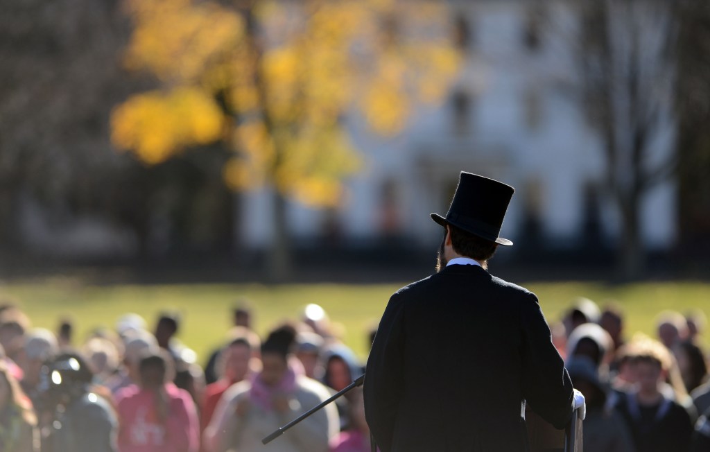 Abraham Lincoln re-enactor Howard Wright recites the Gettysburg Address to students from Norwich Free Academy gathered on Chelsea Parade in Norwich, Conn., to mark the 150th anniversary of the speech Tuesday, Nov. 19, 2013.
