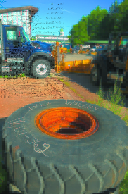 dot digs: This photo taken in August shows the State House dome behind the state Department of Transportation Fleet Services on Capitol Street in Augusta. The fleet service maintenance garage will be moved to Industrial Drive.