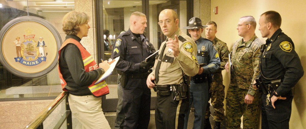 REHEARSE: Kennebec County sheriff’s deputies and Augusta, Capitol and state police prepare to enter the State House on Tuesday in response to a report about a shooter in the building during a simulated drill. The exercise was conducted as part of the Maine National Guard’s regional emergency response program, Vigilant Guard, which will involve up to 3,000 people over the next week, according to a news release from the National Guard.