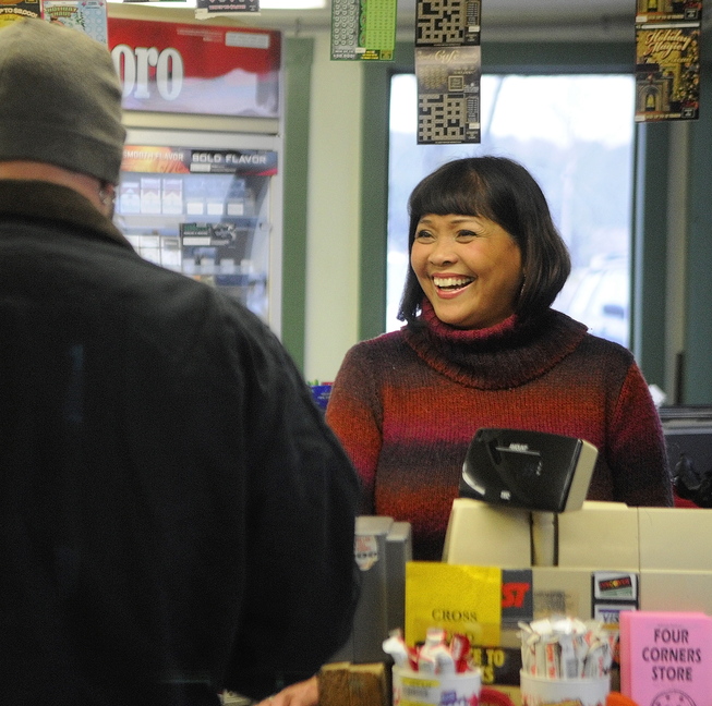 TYPHOON RELIEF: Vicky Staszewski works behind the counter at Four Corners General Store on Thursday in West Gardiner.