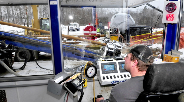 HERE’S THE DRILL: From inside a control building, operation engineer Terry Weber of Nomad Pipeline Services monitors the progress of a drill that is boring a 2,000-foot hole for a natural gas pipeline from Winslow under the Kennebec River to Waterville and Thomas College.