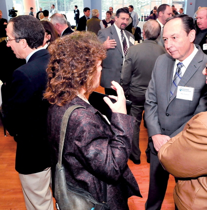 UPDATE: Thomas College President Laurie Lachance speaks with Mike Earnest, founder and CEO of Summit Utilities Inc., on Tuesday.