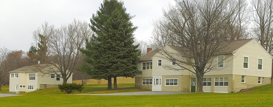 Housing proposal: This photo taken in November on Arsenal Heights in Augusta shows two of the four former group homes that could become temporary housing for those who no longer need the level of care provided at Riverview Psychiatric Center. The four houses on the former Augusta Mental Health Institute campus are near the Kennebec Arsenal on the east side of Augusta.