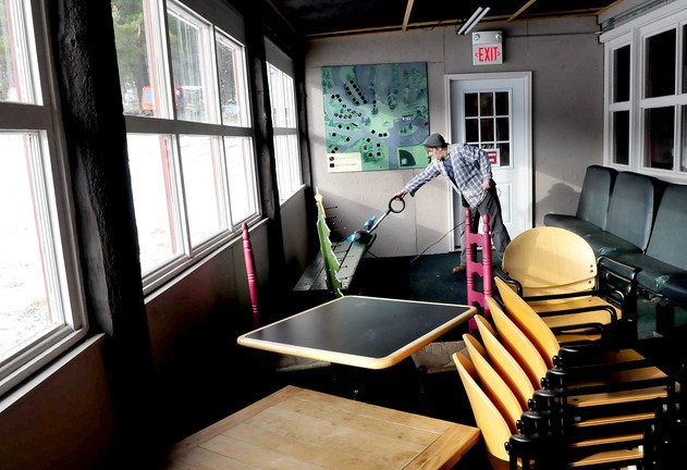 SEASON OPENER: Kelly Paulette prepares the base lodge at Eaton Mountain in Skowhegan on Wednesday for the opening of the hill this Saturday.