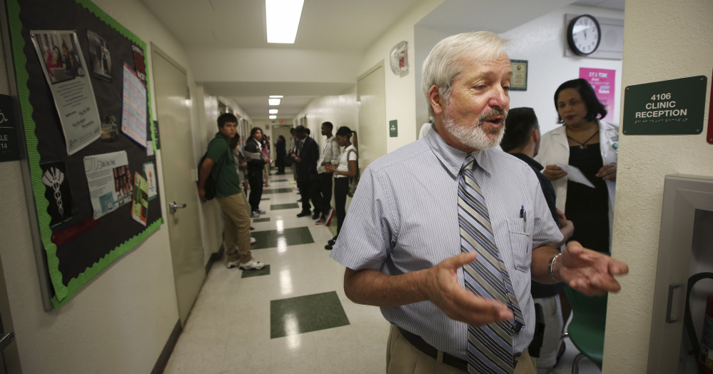 Dr. Arthur Fournier stands in a North Miami clinic, as he discusses a time when a mysterious autoimmune disease baffled doctors and frightened a world unfamiliar with what is now called AIDS.